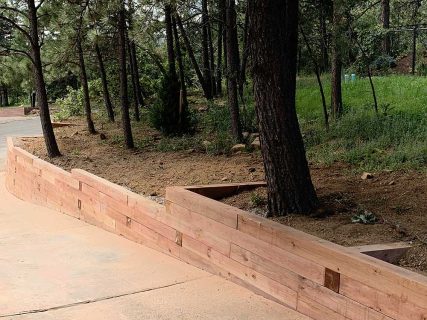 Prevent erosion with a custom built retaining wall by Sundown Landscaping