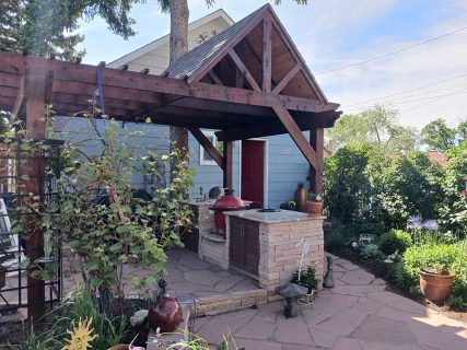 Outdoor kitchen area, pergola, by Sundown Landscaping in Colorado Springs