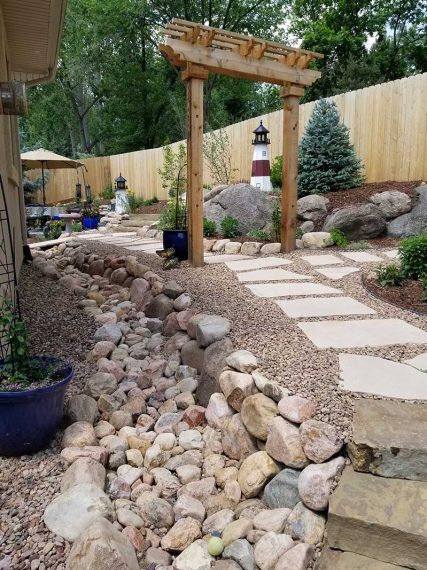 Arbor, walkway and patio by Sundown Landscaping, a Colorado Springs Landscaper