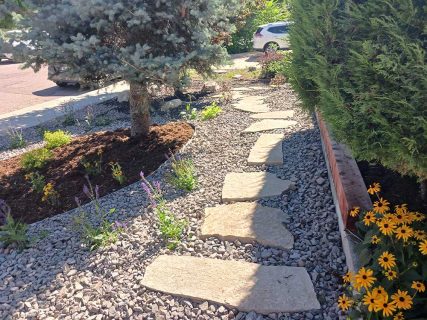 Walkway and plantings in Colorado Springs backyard by Sundown Landscaping